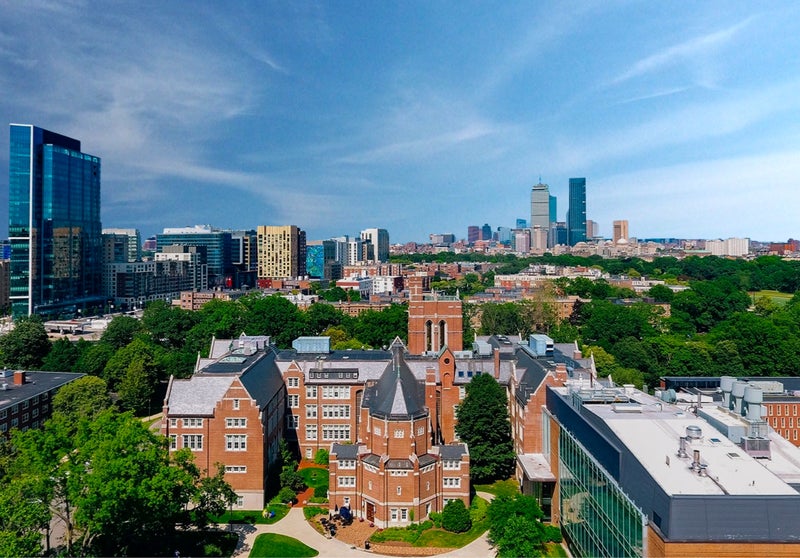 Aerial shot of Emmanuel College campus with Boston skyline in background